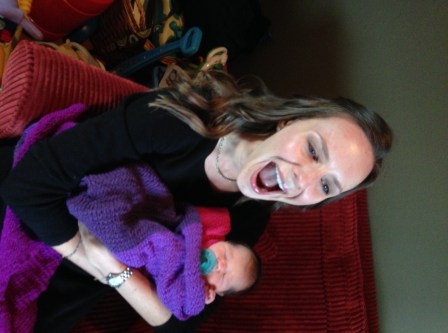 This is a horrible picture of me, but I think it captures how excited I am to be holding her for the first time. Also, check out the blanket I knit her!
