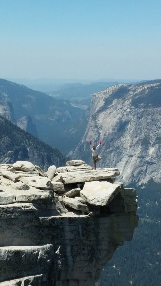 Doing a really horrible tree pose which was a combination of doing yoga in hiking boots, fatigue, and doing whatever I could to minimize falling out of the pose. Because in the yoga room when you fall, you get back into the pose. On a mountain, you fall out of a pose and you die. 